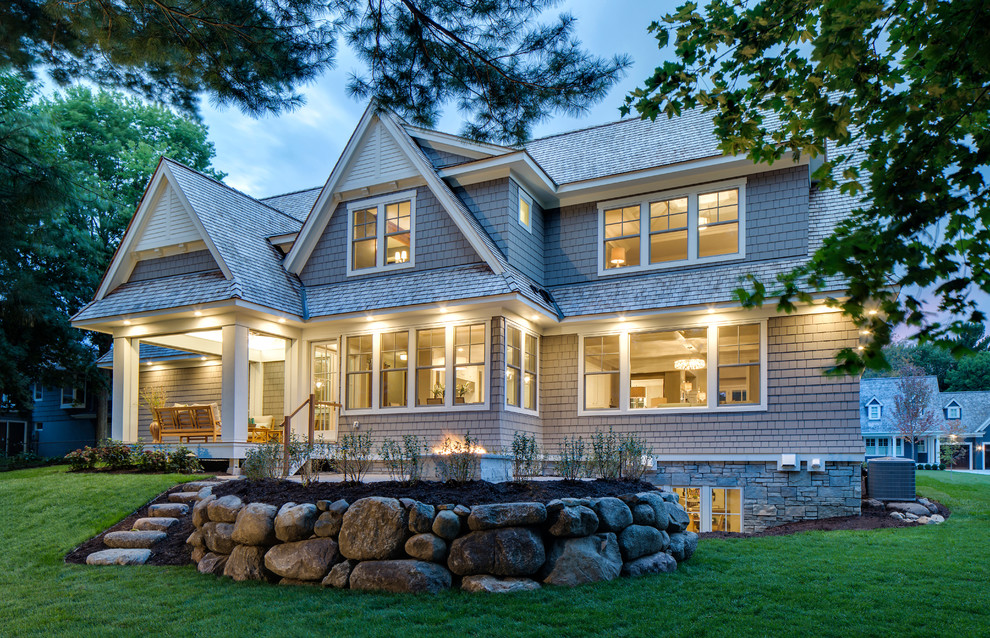 Design ideas for a large traditional two-storey exterior in Minneapolis with wood siding.