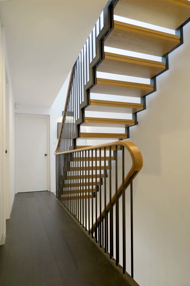Inspiration for a mid-sized contemporary wood straight staircase in Sydney with open risers and metal railing.