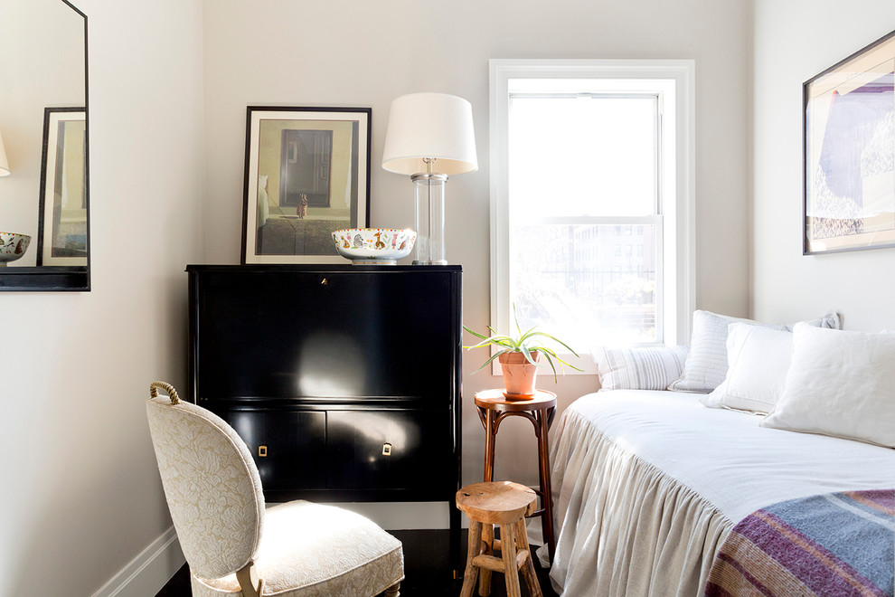 Inspiration for a mid-sized transitional guest bedroom in New York with white walls, dark hardwood floors and no fireplace.