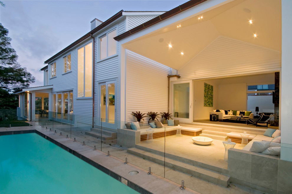 Inspiration for a transitional patio in Auckland with a roof extension.