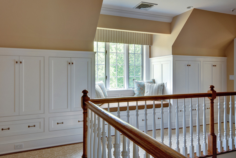 This is an example of a traditional hallway in New York with beige walls.