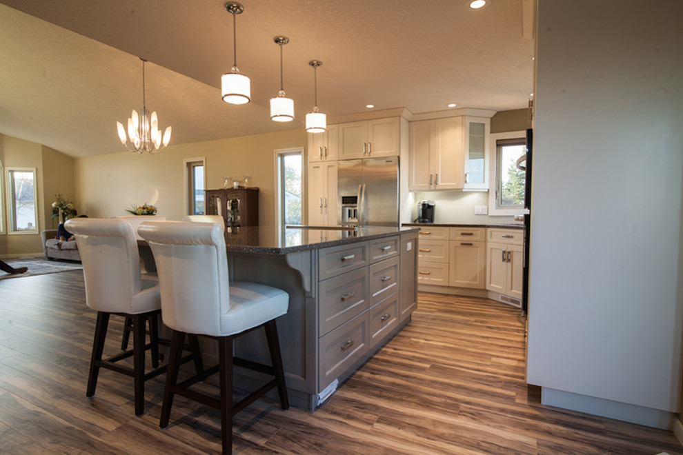 Inspiration for a transitional kitchen remodel in Edmonton with white cabinets
