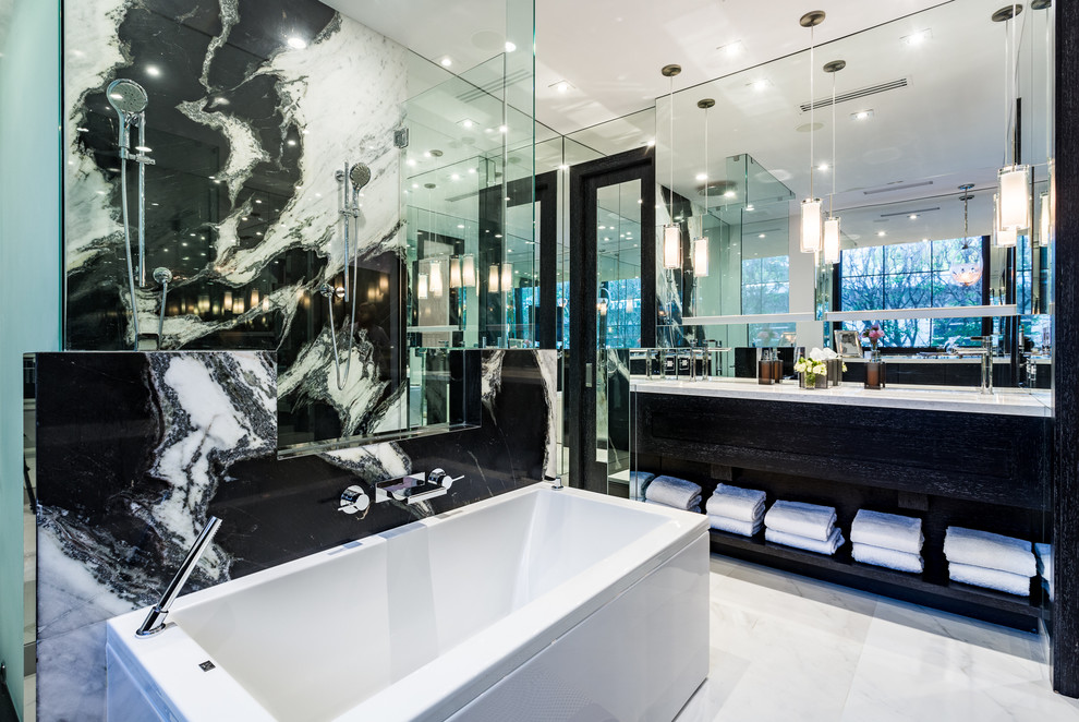 This is an example of a large contemporary master bathroom in Miami with furniture-like cabinets, black cabinets, a drop-in tub, a double shower, stone slab, white walls, an undermount sink, engineered quartz benchtops and an open shower.