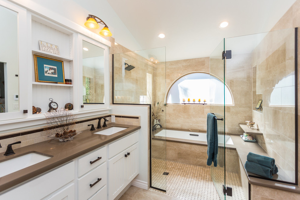 Design ideas for a large transitional master bathroom in Phoenix with recessed-panel cabinets, white cabinets, an undermount tub, a curbless shower, beige tile, porcelain tile, white walls, marble floors, an undermount sink, engineered quartz benchtops, brown floor and a hinged shower door.