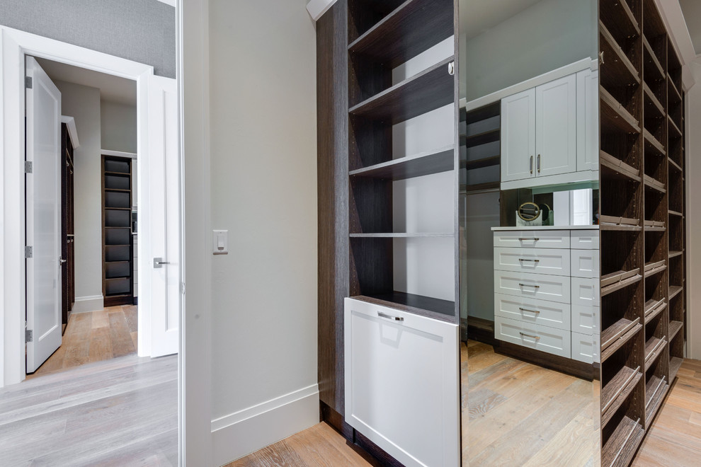 Inspiration for a large walk-in closet remodel with shaker cabinets