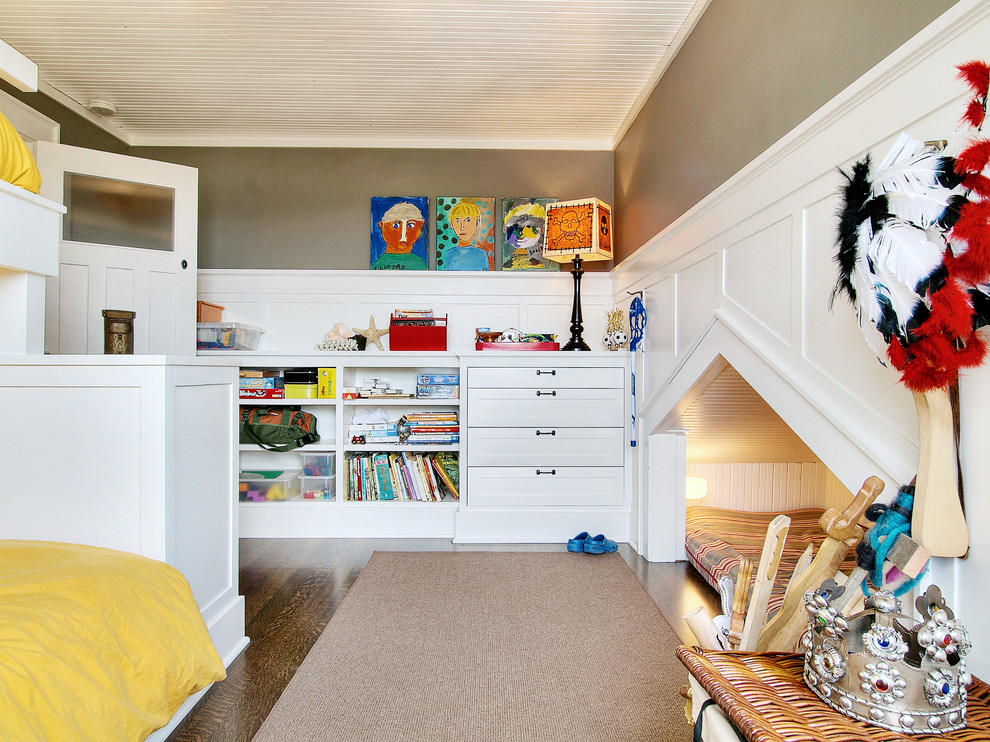 This is an example of an eclectic gender-neutral kids' playroom in Seattle with grey walls, dark hardwood floors and brown floor.