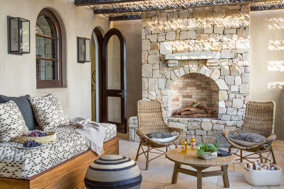 Photo of a mediterranean patio in San Francisco with a pergola and with fireplace.