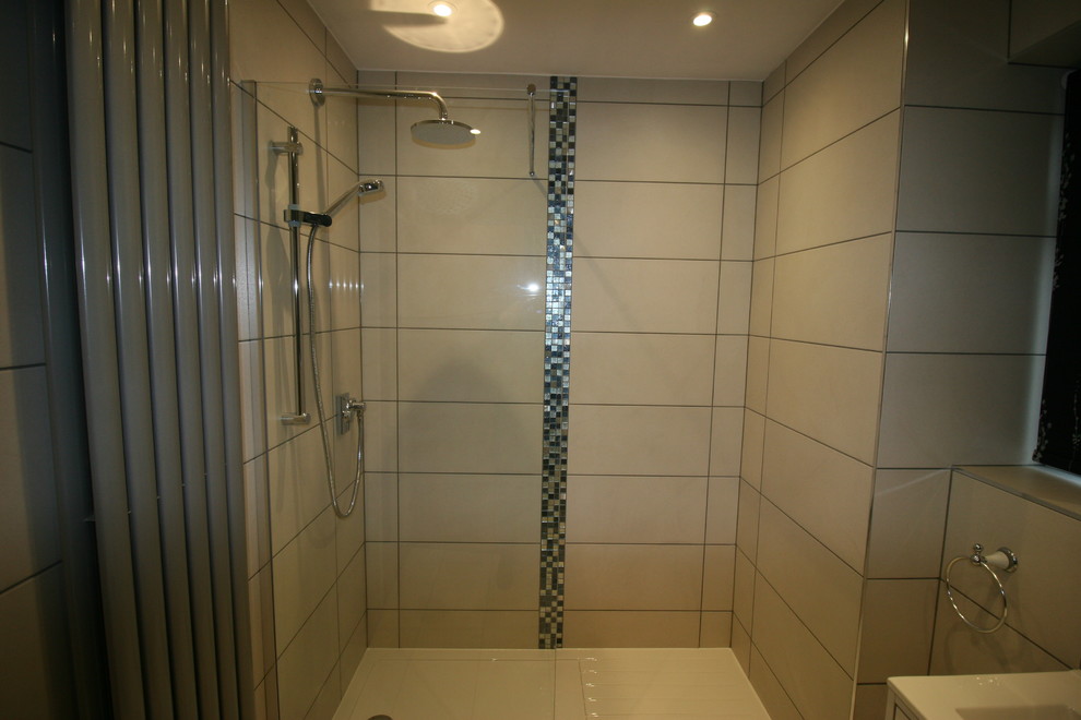 Photo of a small modern 3/4 bathroom in Sussex with beaded inset cabinets, white cabinets, beige tile, porcelain tile, porcelain floors and beige floor.