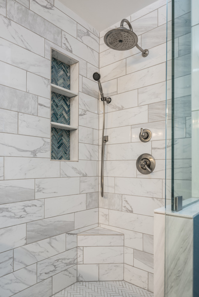 Photo of a small transitional master bathroom in Dallas with glass-front cabinets, white cabinets, a corner shower, a one-piece toilet, blue tile, porcelain tile, blue walls, porcelain floors, an undermount sink, marble benchtops, white floor, a hinged shower door, white benchtops, a niche, a double vanity and a freestanding vanity.