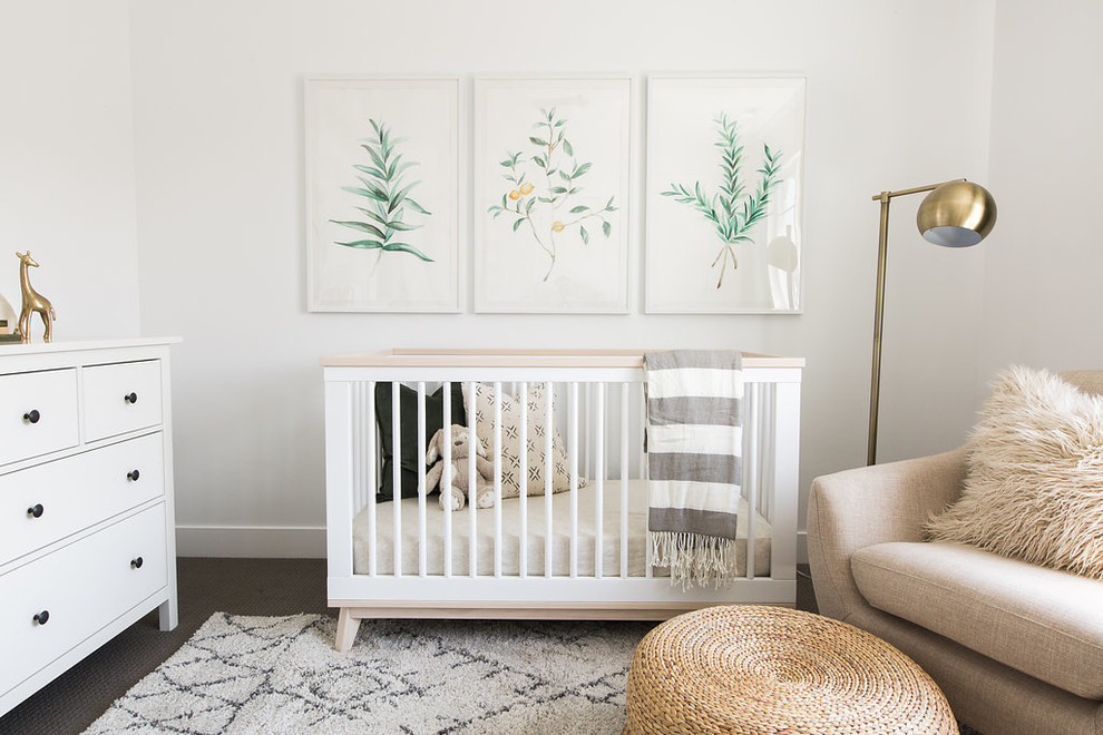 Photo of a transitional gender-neutral nursery in Salt Lake City with white walls.