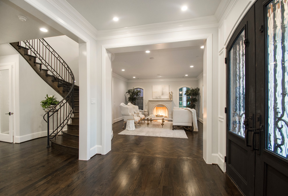Foyer - mid-sized transitional foyer idea in Dallas with white walls and a dark wood front door