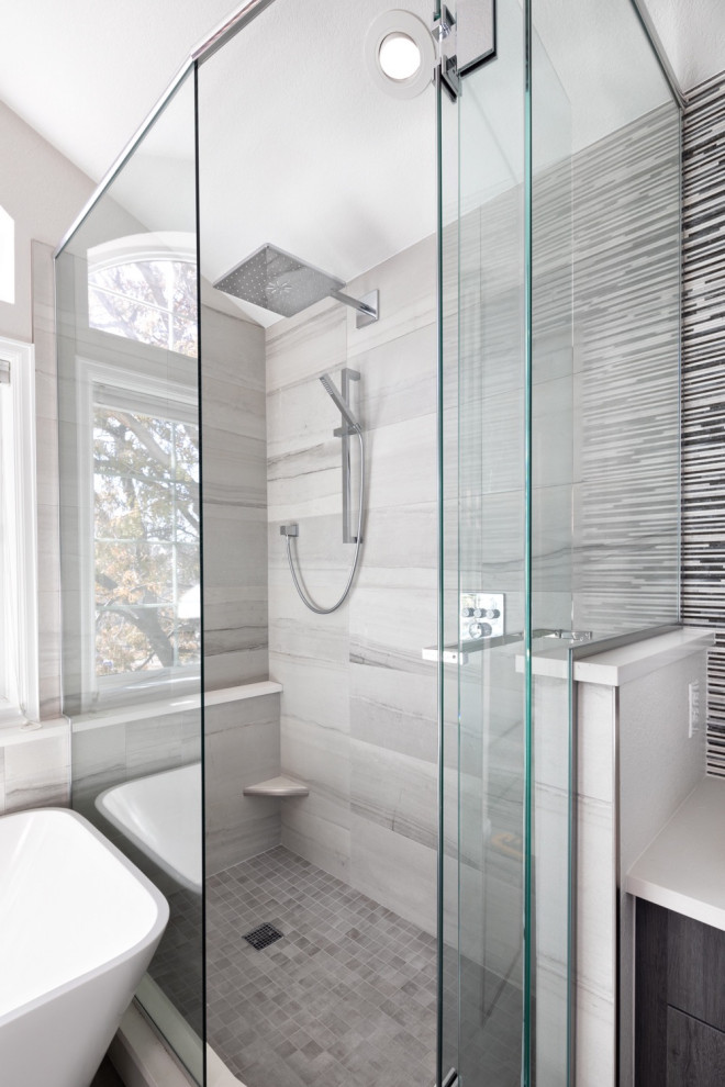 This is an example of a large contemporary master bathroom in Denver with flat-panel cabinets, white cabinets, a freestanding tub, an open shower, multi-coloured tile, white walls, slate floors, a vessel sink, quartzite benchtops, grey floor, a hinged shower door, white benchtops, a single vanity and a built-in vanity.