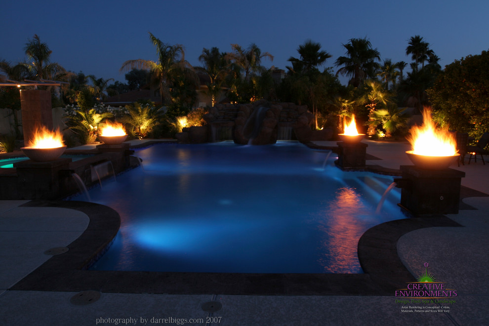 Inspiration for a large backyard stamped concrete and custom-shaped hot tub remodel in Phoenix
