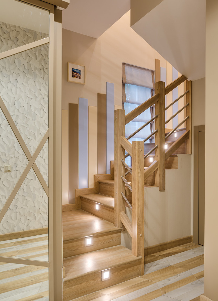 Photo of a wood u-shaped staircase in Osaka with wood risers and mixed railing.