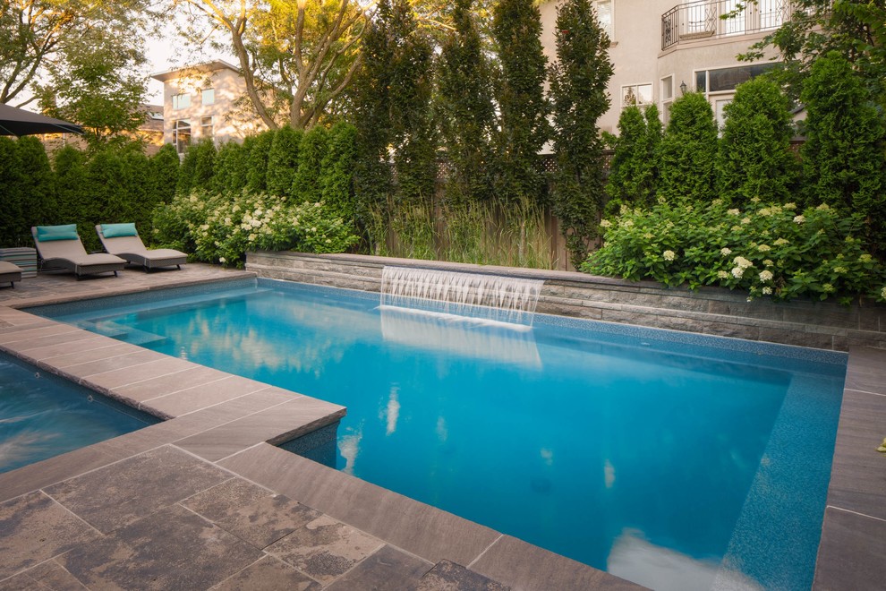 Hot tub - small transitional backyard stone and rectangular hot tub idea in Toronto