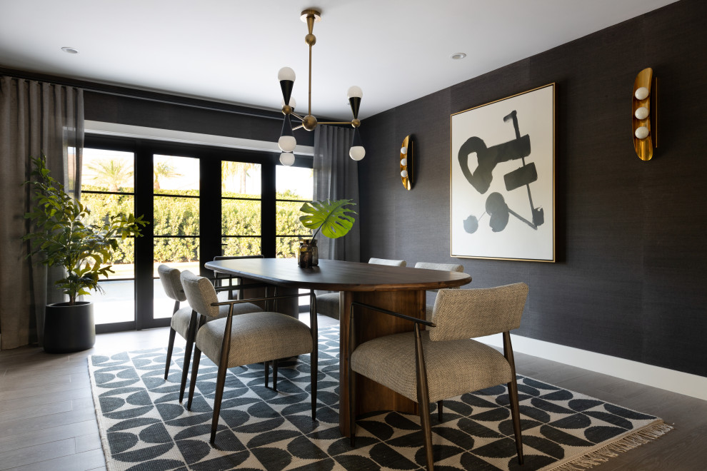 Photo of a large contemporary separate dining room in Miami with black walls, wallpaper, dark hardwood floors and brown floor.