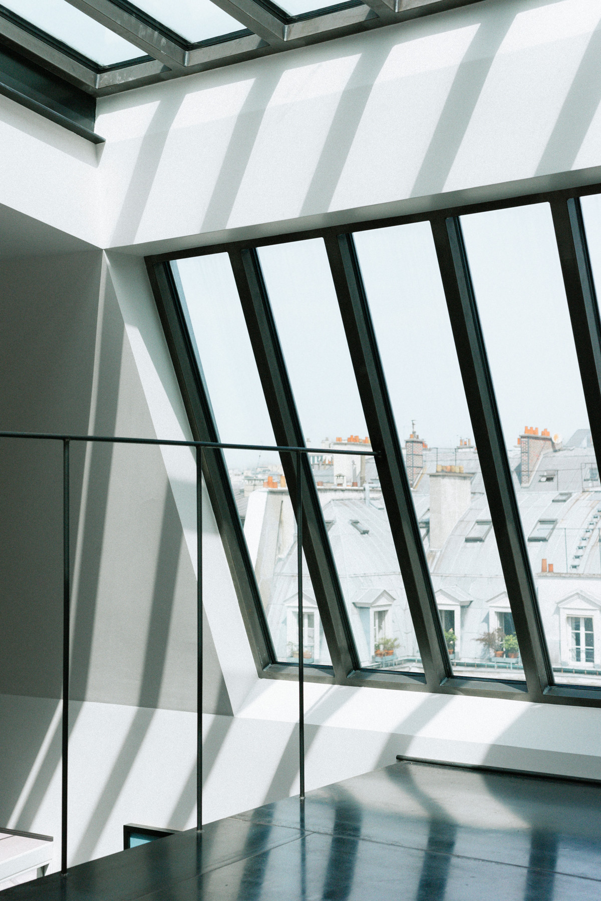 Réhabilitation d'un duplex esprit loft avec toit verrière coulissant