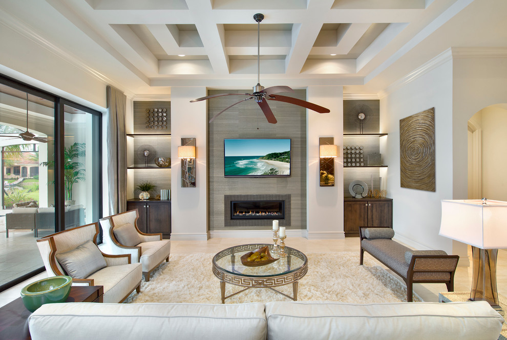 Photo of a transitional formal open concept living room in Miami with white walls, a ribbon fireplace, a tile fireplace surround and a wall-mounted tv.