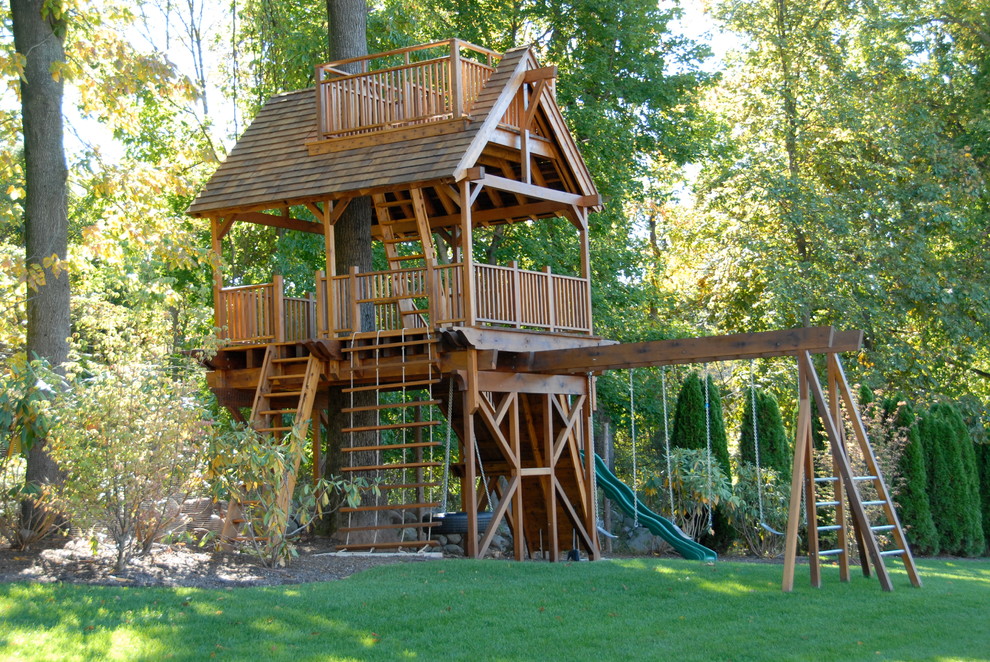 Traditional garden in New York with with outdoor playset.