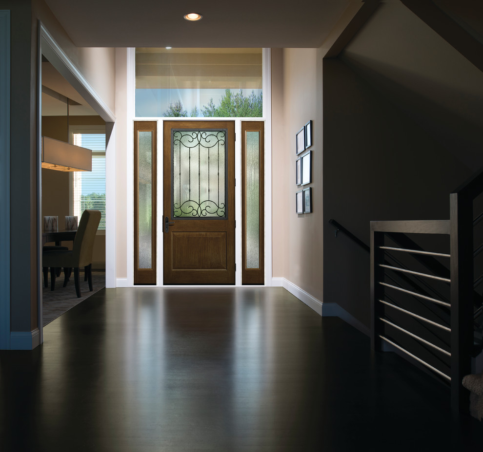 Example of a large transitional dark wood floor and brown floor front door design in Boston with beige walls and a dark wood front door