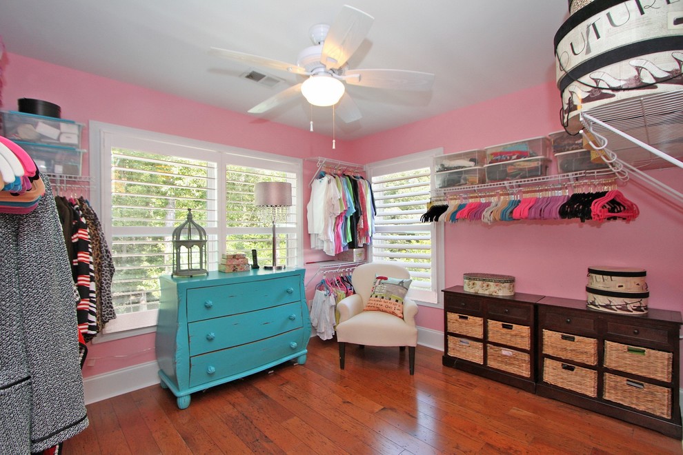 Inspiration for an expansive traditional women's dressing room in Charleston with medium hardwood floors.
