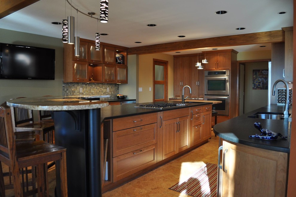Eat-in kitchen - large rustic u-shaped eat-in kitchen idea in Boise with a double-bowl sink, glass-front cabinets, light wood cabinets, soapstone countertops, matchstick tile backsplash, stainless steel appliances and two islands