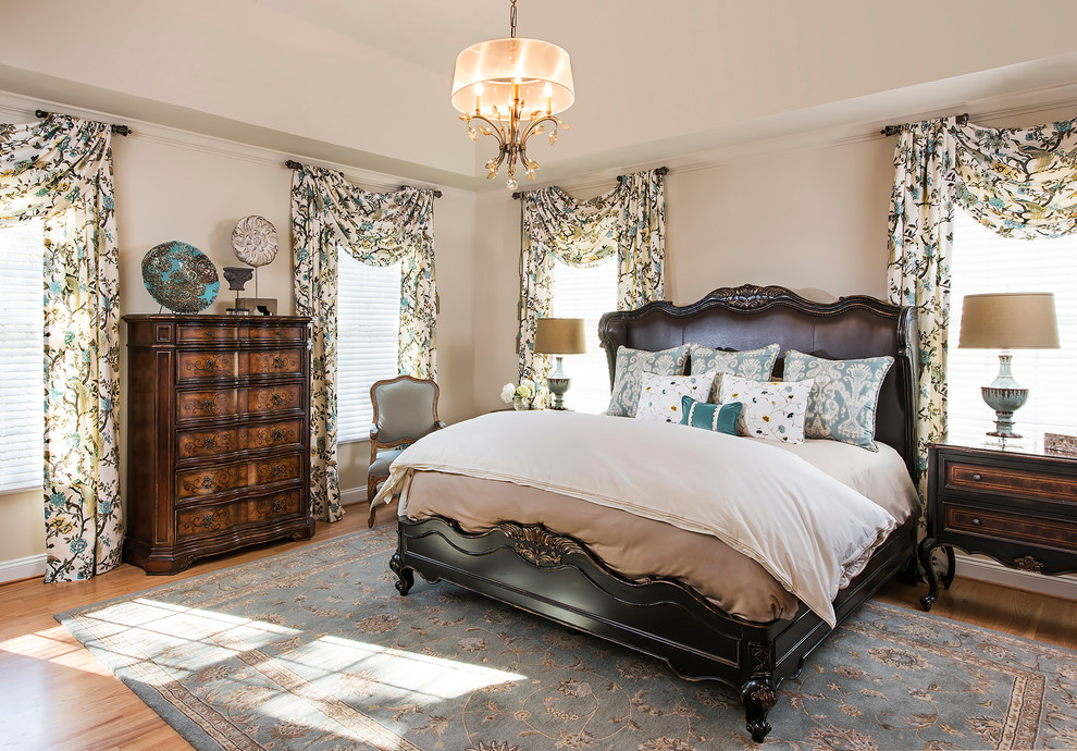 Design ideas for a traditional master bedroom in DC Metro with beige walls and light hardwood floors.