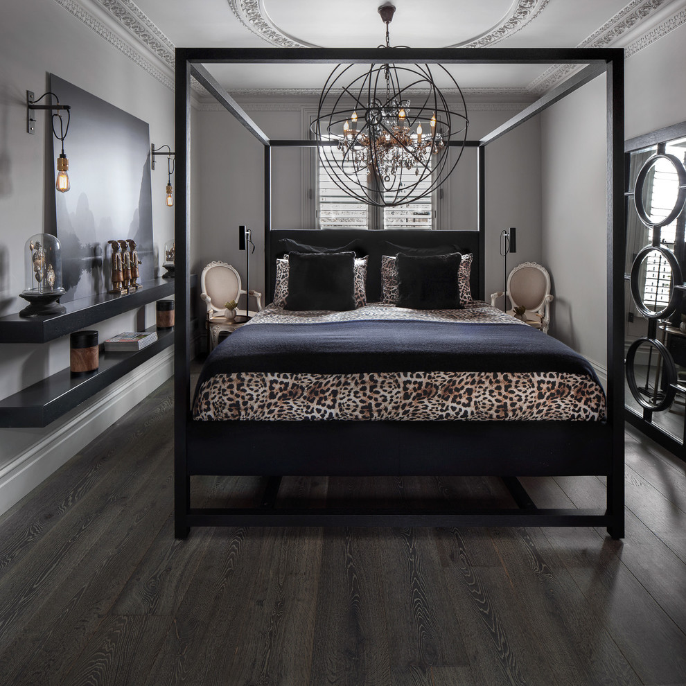 Photo of a transitional bedroom in London with grey walls, dark hardwood floors and no fireplace.