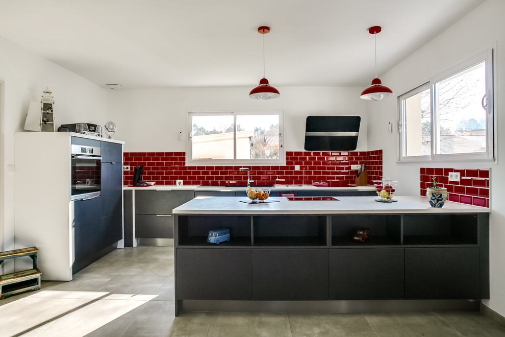 Design ideas for a large contemporary galley kitchen in Bordeaux with grey cabinets, laminate benchtops, red splashback, subway tile splashback, stainless steel appliances, ceramic floors, flat-panel cabinets and grey floor.