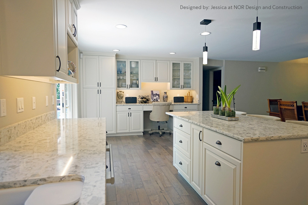 Eat-in kitchen - large transitional u-shaped medium tone wood floor eat-in kitchen idea in Seattle with recessed-panel cabinets, white cabinets, quartzite countertops, stainless steel appliances, an island and white countertops