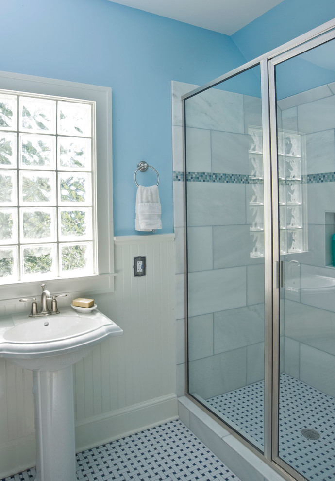 This is an example of a traditional 3/4 bathroom in Atlanta with a pedestal sink, an alcove shower, white tile, ceramic tile, blue walls and ceramic floors.
