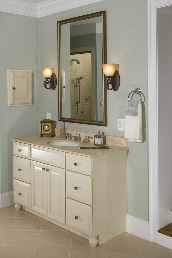 Design ideas for a mid-sized traditional bathroom in DC Metro with an undermount sink, raised-panel cabinets, white cabinets, granite benchtops, beige tile, porcelain tile, blue walls and porcelain floors.