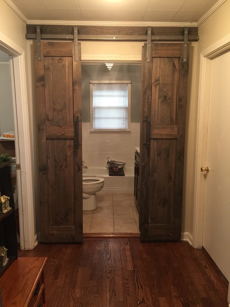 Example of a small mountain style 3/4 dark wood floor bathroom design with dark wood cabinets and beige walls