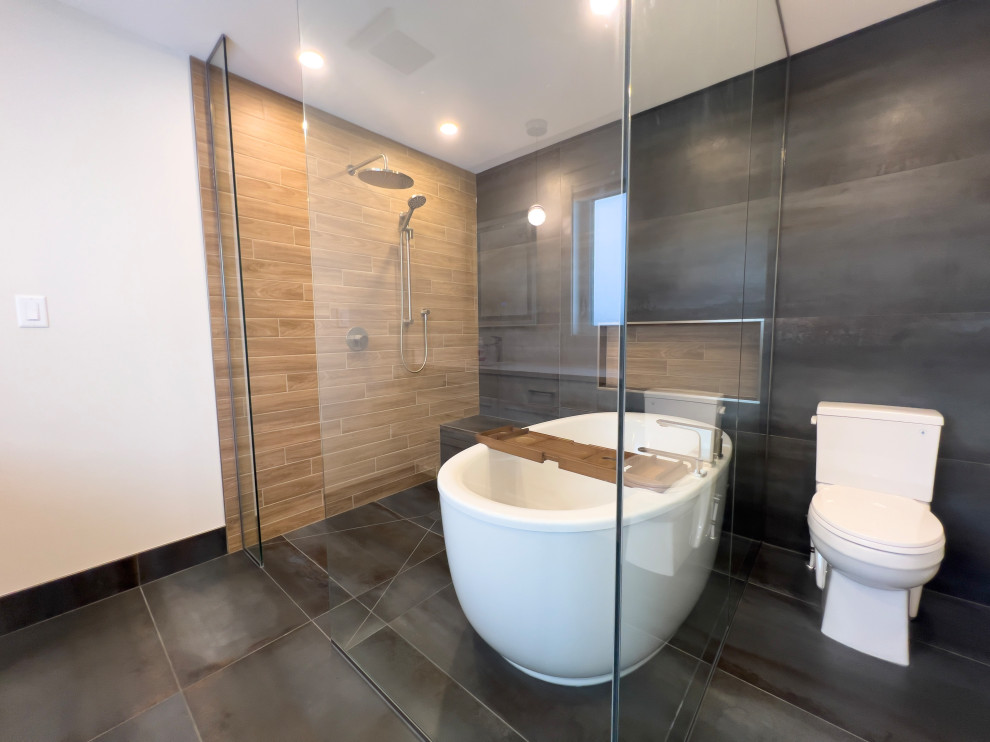 Large modern ensuite bathroom in Edmonton with recessed-panel cabinets, white cabinets, a freestanding bath, a built-in shower, a two-piece toilet, blue tiles, wood-effect tiles, white walls, porcelain flooring, a submerged sink, engineered stone worktops, blue floors, an open shower, white worktops, a shower bench, double sinks and a built in vanity unit.