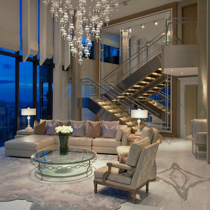 Inspiration for a large contemporary formal open concept living room with beige walls, marble floors, a freestanding tv and white floor.