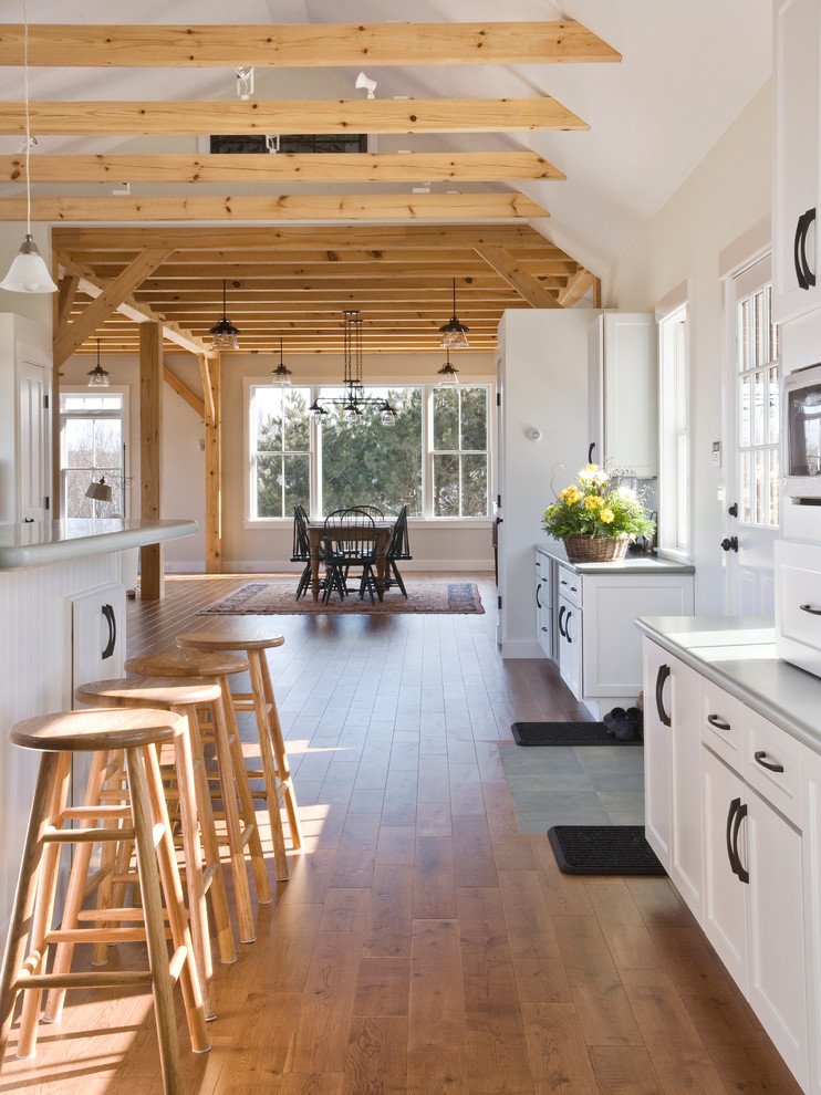This is an example of a traditional kitchen in Portland Maine with recessed-panel cabinets and white cabinets.