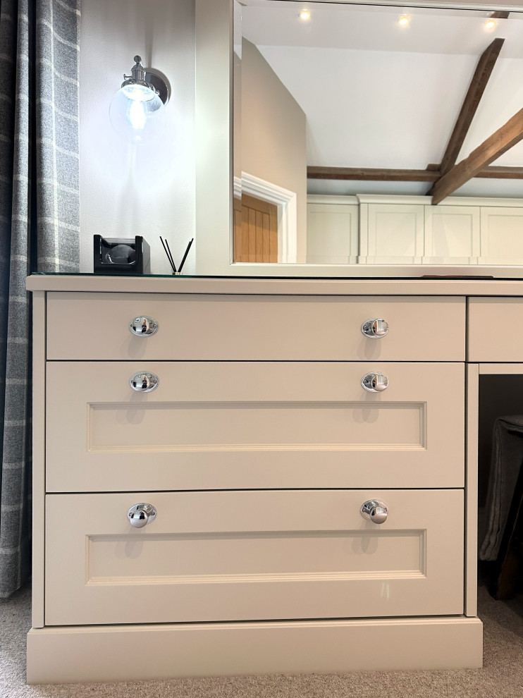 Medium sized traditional master bedroom in Other with carpet and feature lighting.