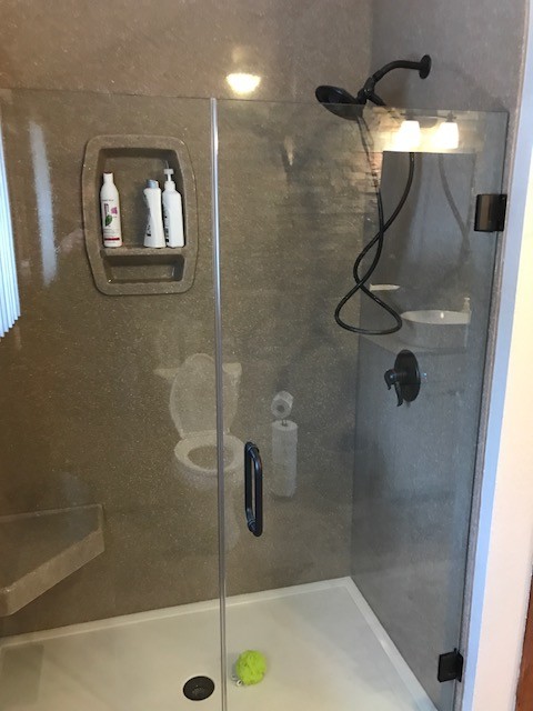 Inspiration for a mid-sized rustic master gray tile and stone tile ceramic tile and beige floor alcove shower remodel with shaker cabinets, white cabinets, a two-piece toilet, gray walls, a vessel sink, laminate countertops and a hinged shower door