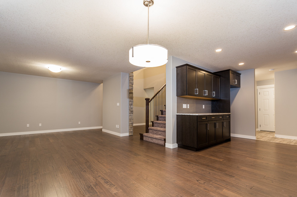 Transitional home design photo in Edmonton