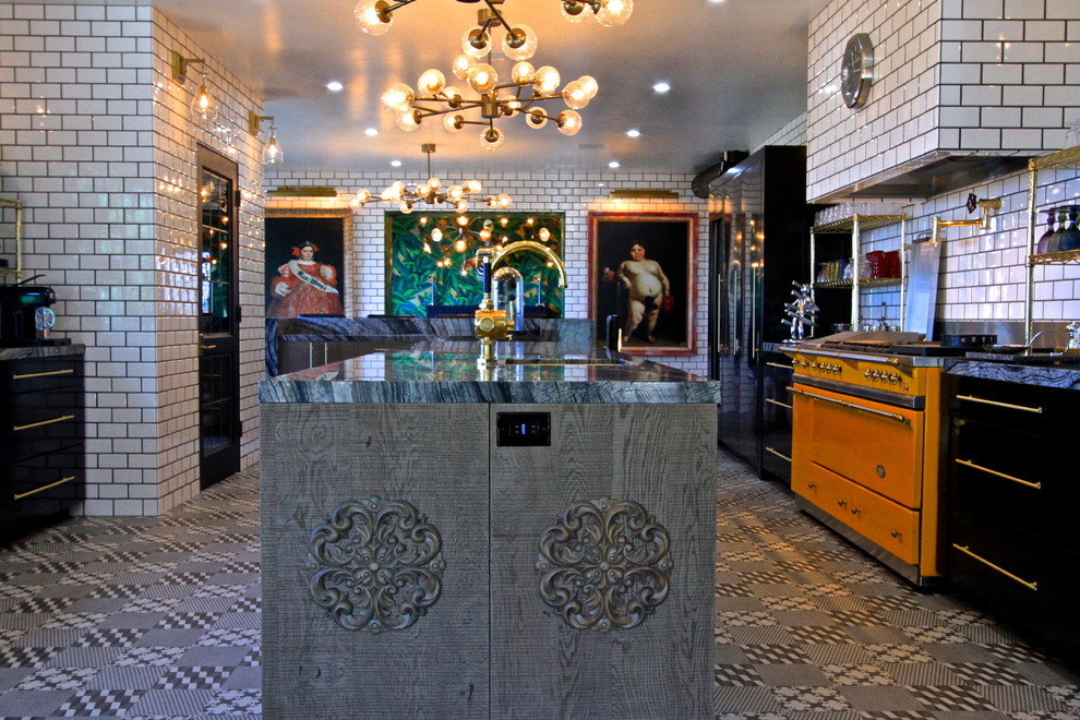 Example of a huge eclectic l-shaped ceramic tile enclosed kitchen design in Orange County with an undermount sink, flat-panel cabinets, gray cabinets, marble countertops, white backsplash, subway tile backsplash, black appliances and an island