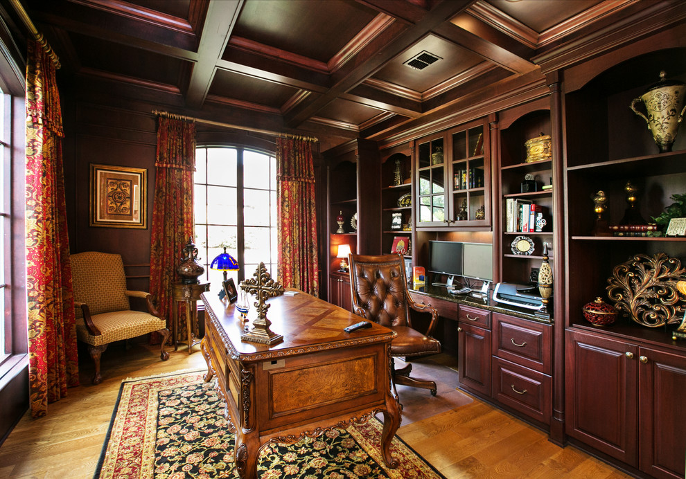 Traditional home office in Dallas with a freestanding desk.