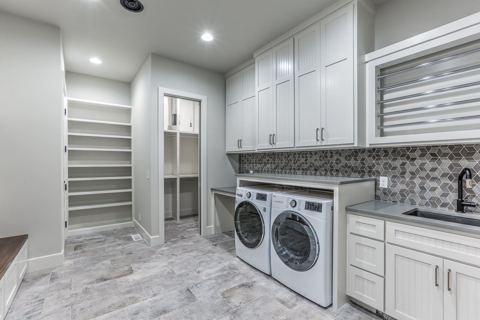 Example of a mountain style laundry room design in Omaha
