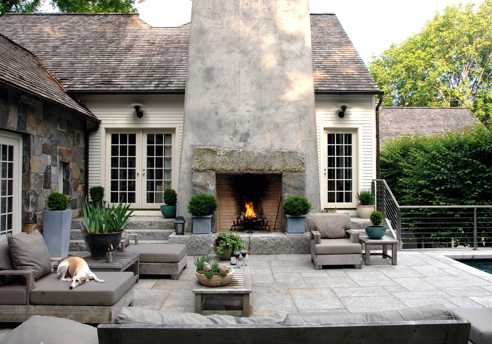 Photo of a traditional patio in New York with a fire feature and no cover.