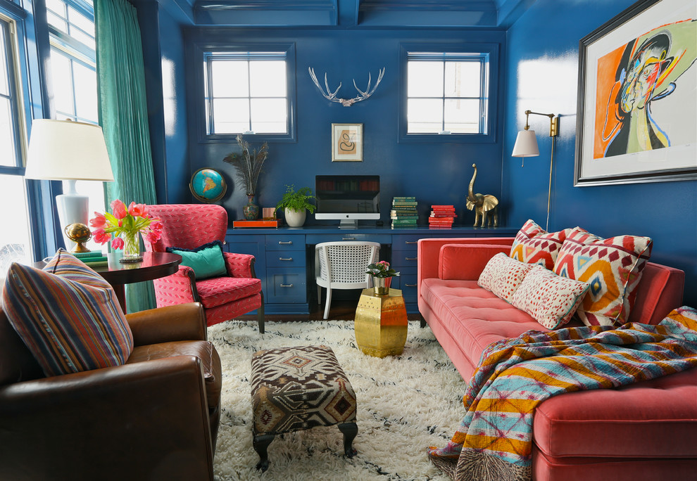 Eclectic home office in Chicago with a built-in desk.