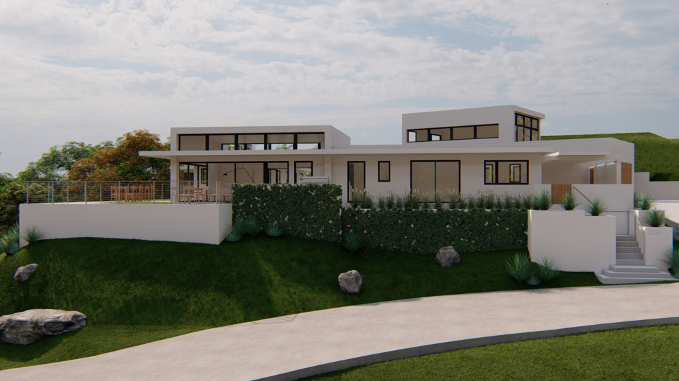 Immagine della villa grande bianca moderna a due piani con rivestimento in stucco e tetto piano