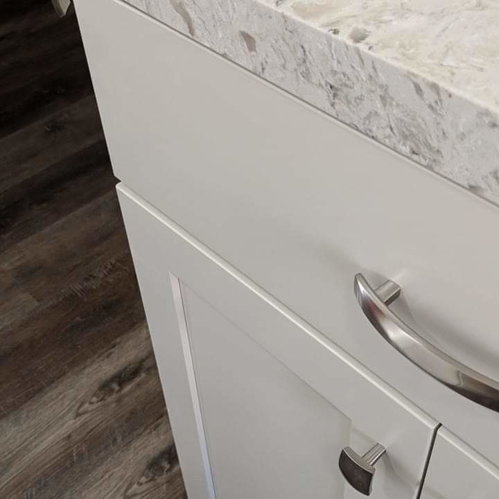 Inspiration for a large transitional u-shaped dark wood floor and brown floor eat-in kitchen remodel in Los Angeles with an undermount sink, recessed-panel cabinets, gray cabinets, quartzite countertops, white backsplash, ceramic backsplash, stainless steel appliances, an island and white countertops