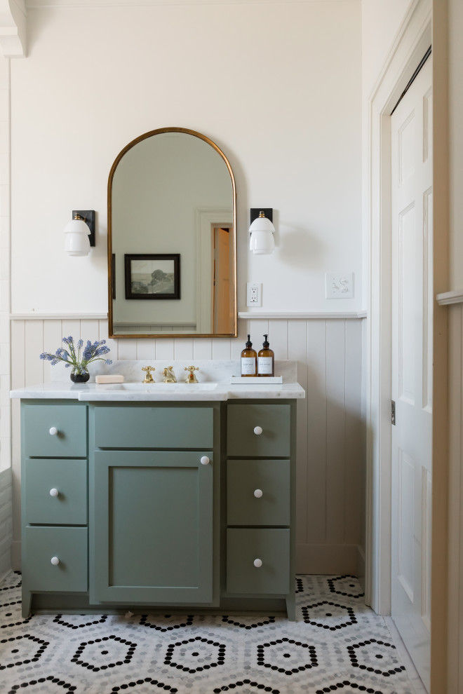 Inspiration for a traditional bathroom in Jackson with shaker cabinets, green cabinets, white walls, mosaic tile flooring, a submerged sink, multi-coloured floors, white worktops, a single sink, a freestanding vanity unit and wainscoting.