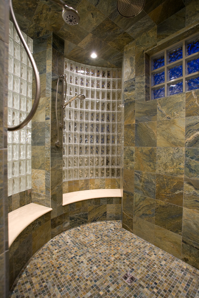 This is an example of a large contemporary master bathroom in Denver with flat-panel cabinets, dark wood cabinets, a drop-in tub, an alcove shower, beige tile, brown tile, gray tile, white tile, mosaic tile, beige walls, slate floors, an integrated sink and glass benchtops.