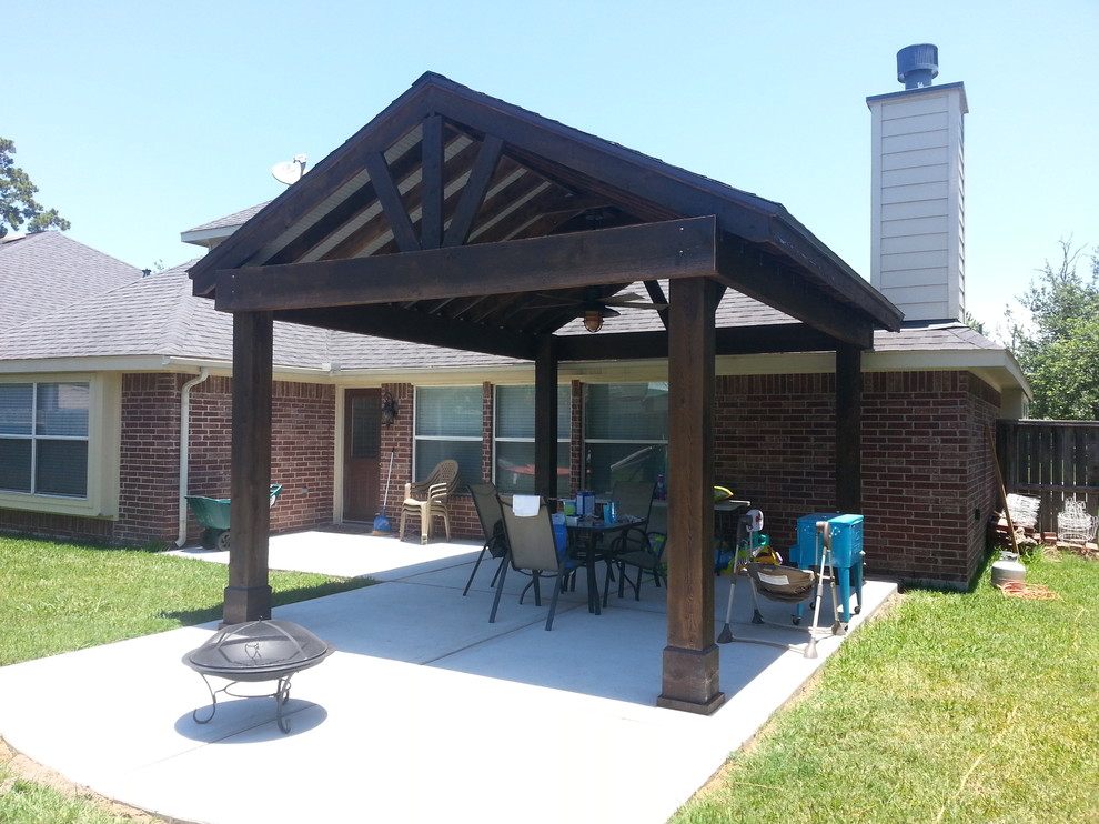 Inspiration for a small backyard patio in Houston with concrete slab and a gazebo/cabana.