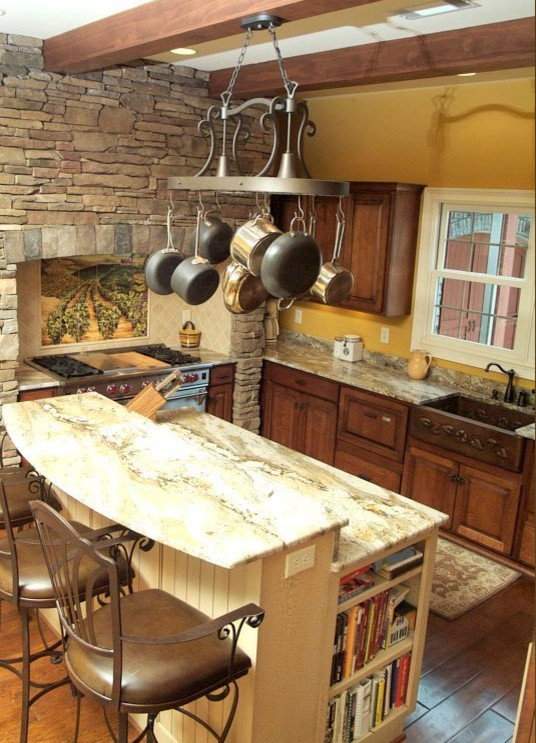 Eat-in kitchen - mid-sized transitional dark wood floor eat-in kitchen idea with a farmhouse sink, raised-panel cabinets, medium tone wood cabinets, granite countertops, beige backsplash, porcelain backsplash, stainless steel appliances and an island